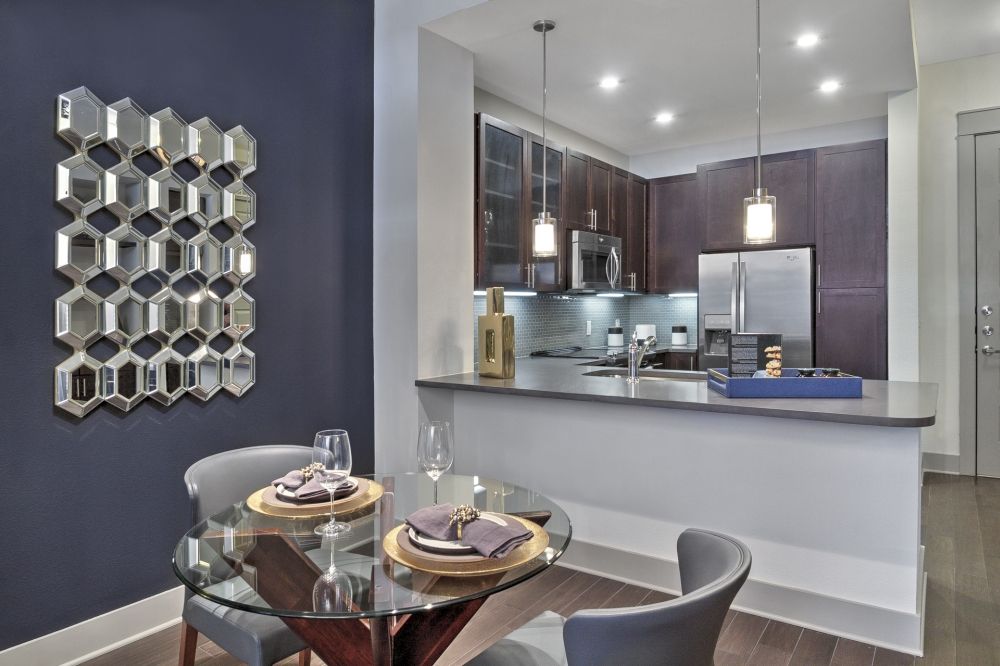 https://apartmentsinheightshouston.com/wp-content/uploads/photo-gallery/imported_from_media_libray/One-Bedroom-Apartments-in-The-Heights-Houston-TX-Model-Dining-Room-with-View-to-Kitchen.jpg?bwg=1655224535