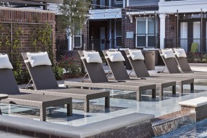 Apartment rentals in The Heights Houston, TX - Pool Tanning Shelf with Lounge Chairs.      